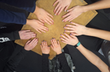 Youth group having a manicure - their hands are looking lovely round the table