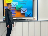 A young person conducting a powerpoint presentation 