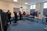 The group sorting out old clothes for their environmental project