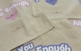 Slogan tote bags that say "you are enough"