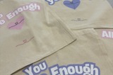 Slogan tote bags that say "you are enough"