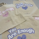 Slogan tote bags that say "you are enough"