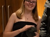 Erin proudly holding her Key Awards for the brilliant work she has done 