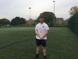 A picture of Jamie on a football pitch