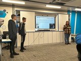 The group conducting a PowerPoint presentation on email scams and cyber security 